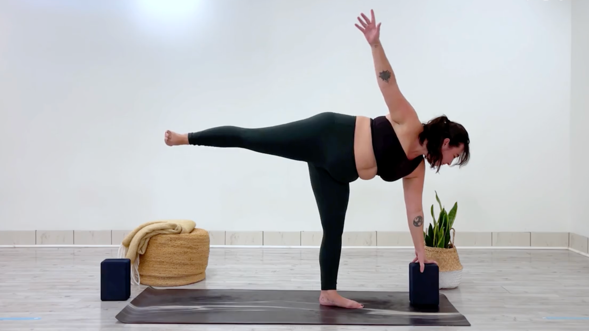 Teacher Taylor Lorenz in Half Moon, Ardha Chandrasana in Sanskrit